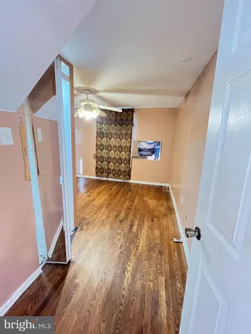 a view of entryway with wooden floor