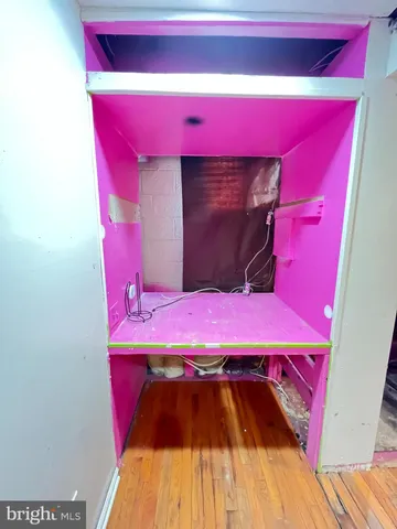 a bedroom with a bed and a mirror