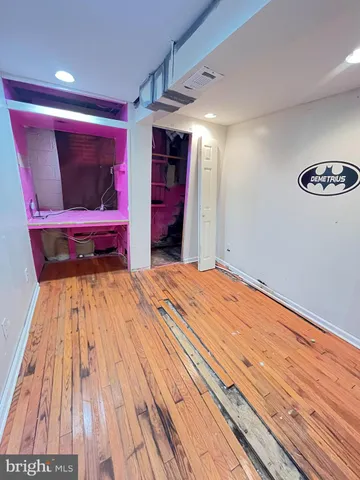 a bedroom with a bed and a mirror