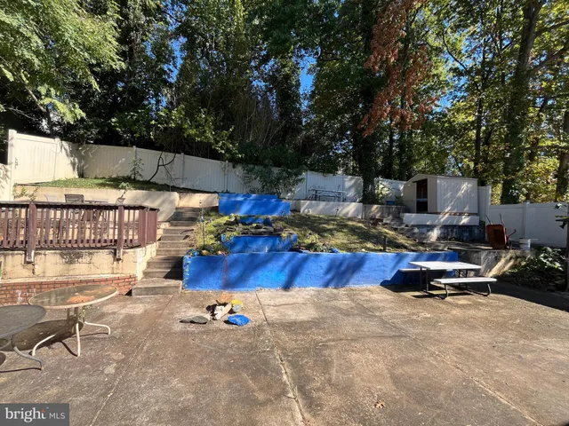 a view of a swimming pool with a patio