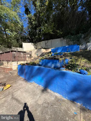 a view of a swimming pool with an outdoor seating