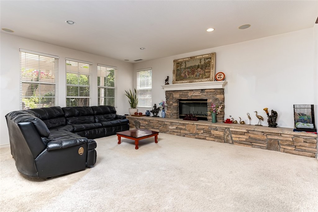 30 Paso Robles Irvine, CA 92602 - Photo 17 of 34 a living room with furniture large window and a fireplace