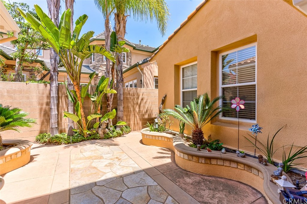30 Paso Robles Irvine, CA 92602 - Photo 3 of 34 a potted plant sitting in front of a house