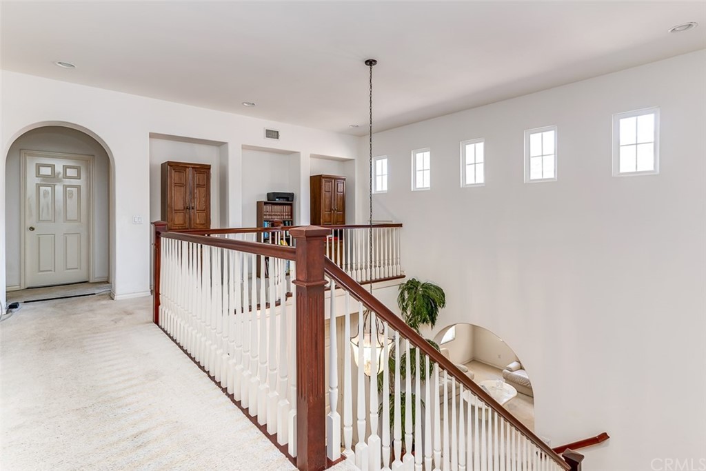 30 Paso Robles Irvine, CA 92602 - Photo 25 of 34 a view of a hallway with wooden floor and stairs