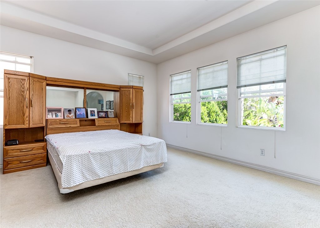 30 Paso Robles Irvine, CA 92602 - Photo 26 of 34 a bedroom with a large bed and a large window