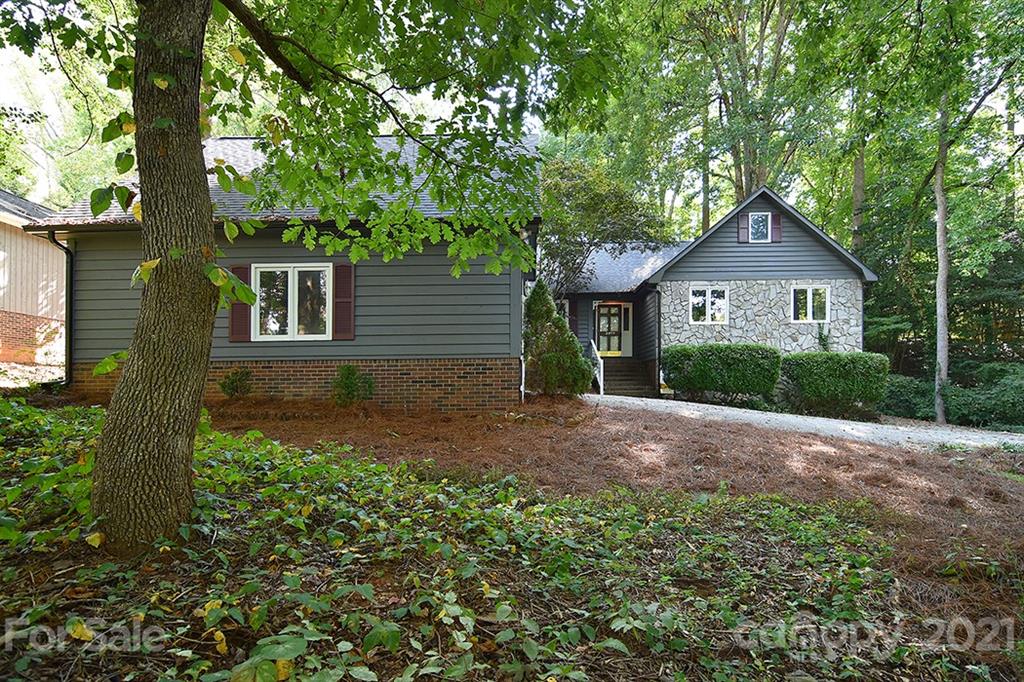 3499 Lake Shore Road South Denver, NC 28037 - Photo 2 of 35 a front view of a house with garden
