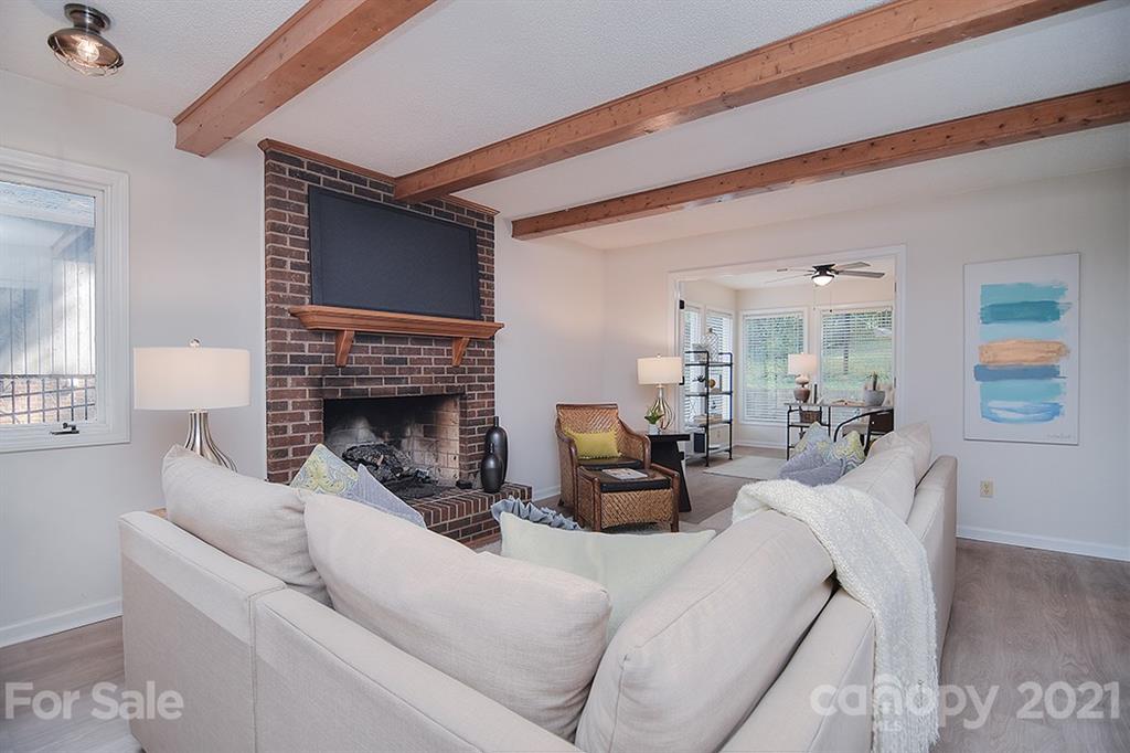 3499 Lake Shore Road South Denver, NC 28037 - Photo 11 of 35 a living room with furniture and a fireplace