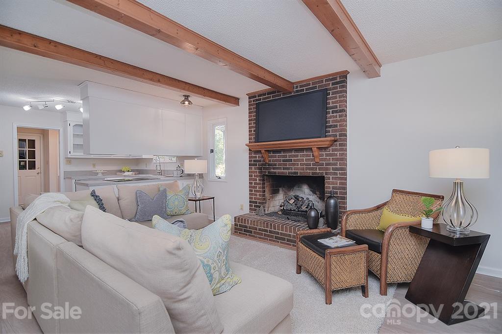 3499 Lake Shore Road South Denver, NC 28037 - Photo 12 of 35 a living room with furniture and a fireplace