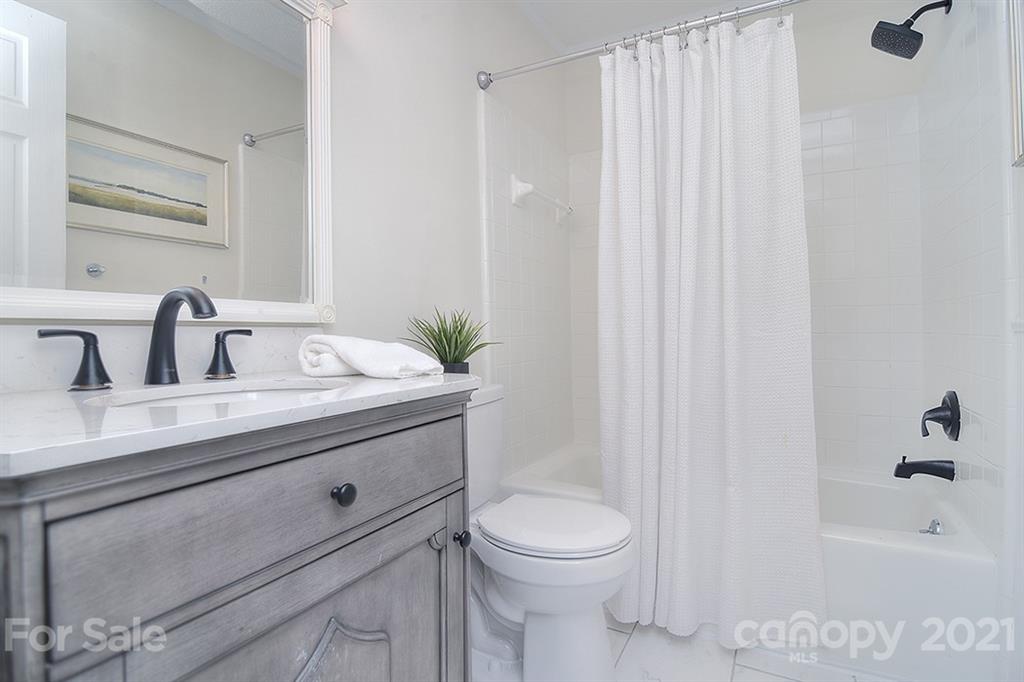 3499 Lake Shore Road South Denver, NC 28037 - Photo 21 of 35 a bathroom with a sink a toilet and shower