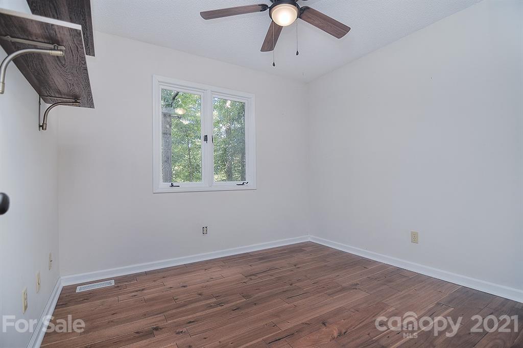 3499 Lake Shore Road South Denver, NC 28037 - Photo 28 of 35 wooden floor in an empty room with a window