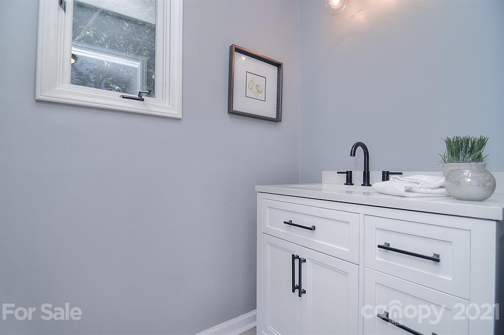 3499 Lake Shore Road South Denver, NC 28037 - Photo 30 of 35 a bathroom with a sink and a mirror