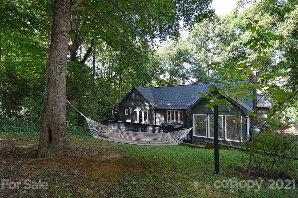 3499 Lake Shore Road South Denver, NC 28037 - Photo 32 of 35 a view of a house with backyard and a tree