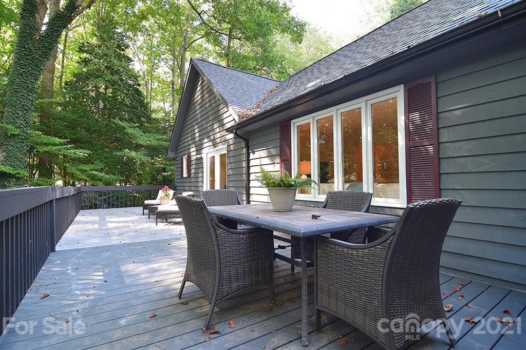 3499 Lake Shore Road South Denver, NC 28037 - Photo 33 of 35 a view of a patio with table and chairs with wooden floor and fence