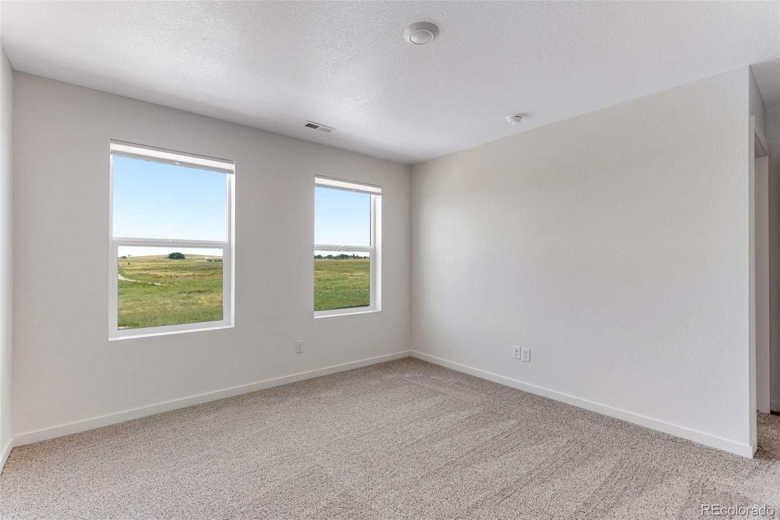 2344 Merlot Street Fort Lupton, CO 80621 - Photo 14 of 23 an empty room with windows