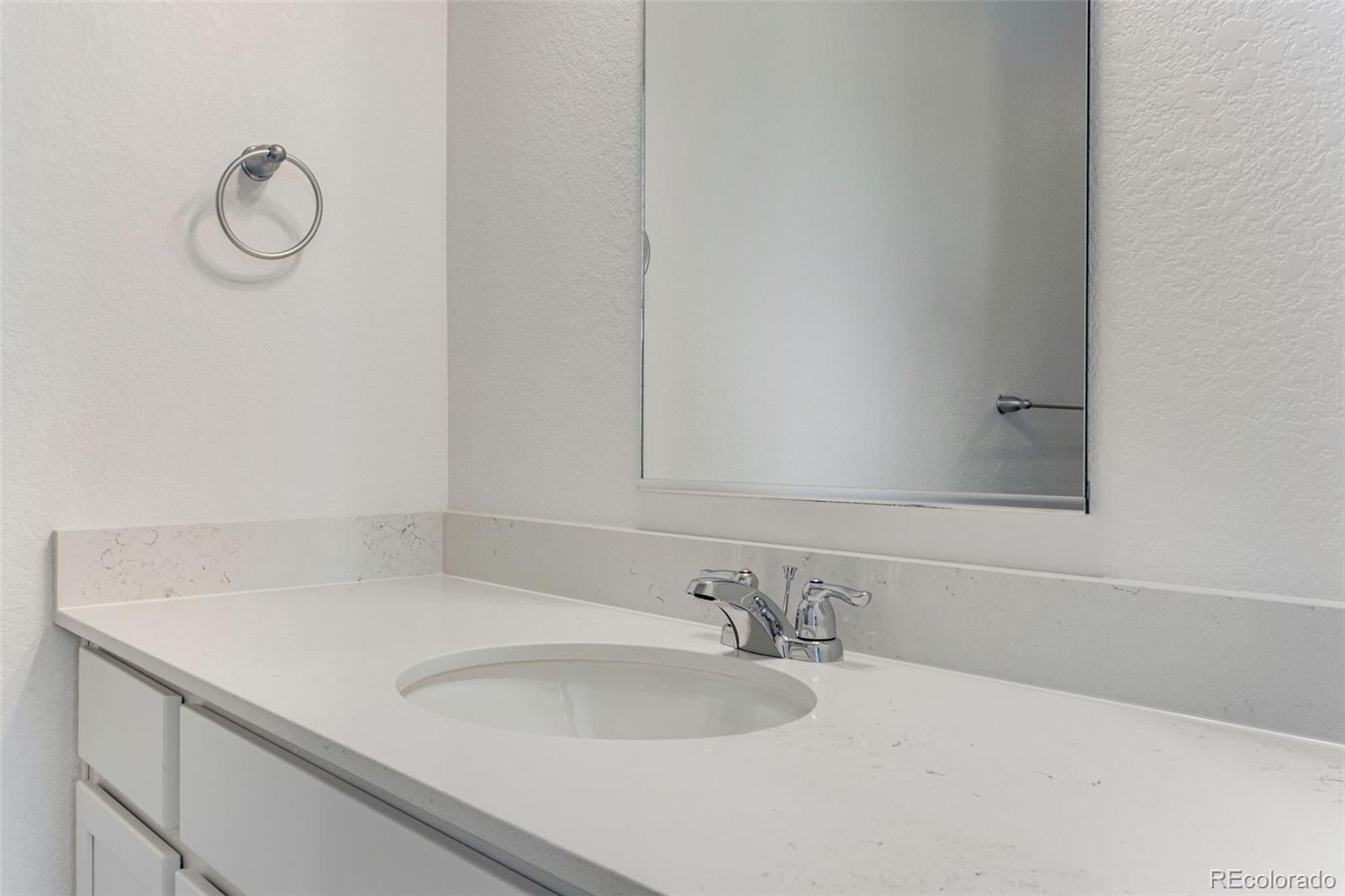 2344 Merlot Street Fort Lupton, CO 80621 - Photo 15 of 23 a bathroom with a sink and a mirror