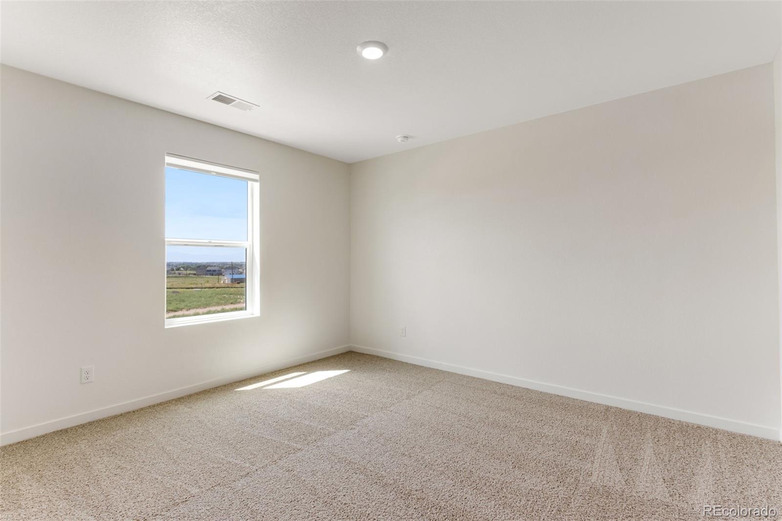 2344 Merlot Street Fort Lupton, CO 80621 - Photo 18 of 23 an empty room with a window