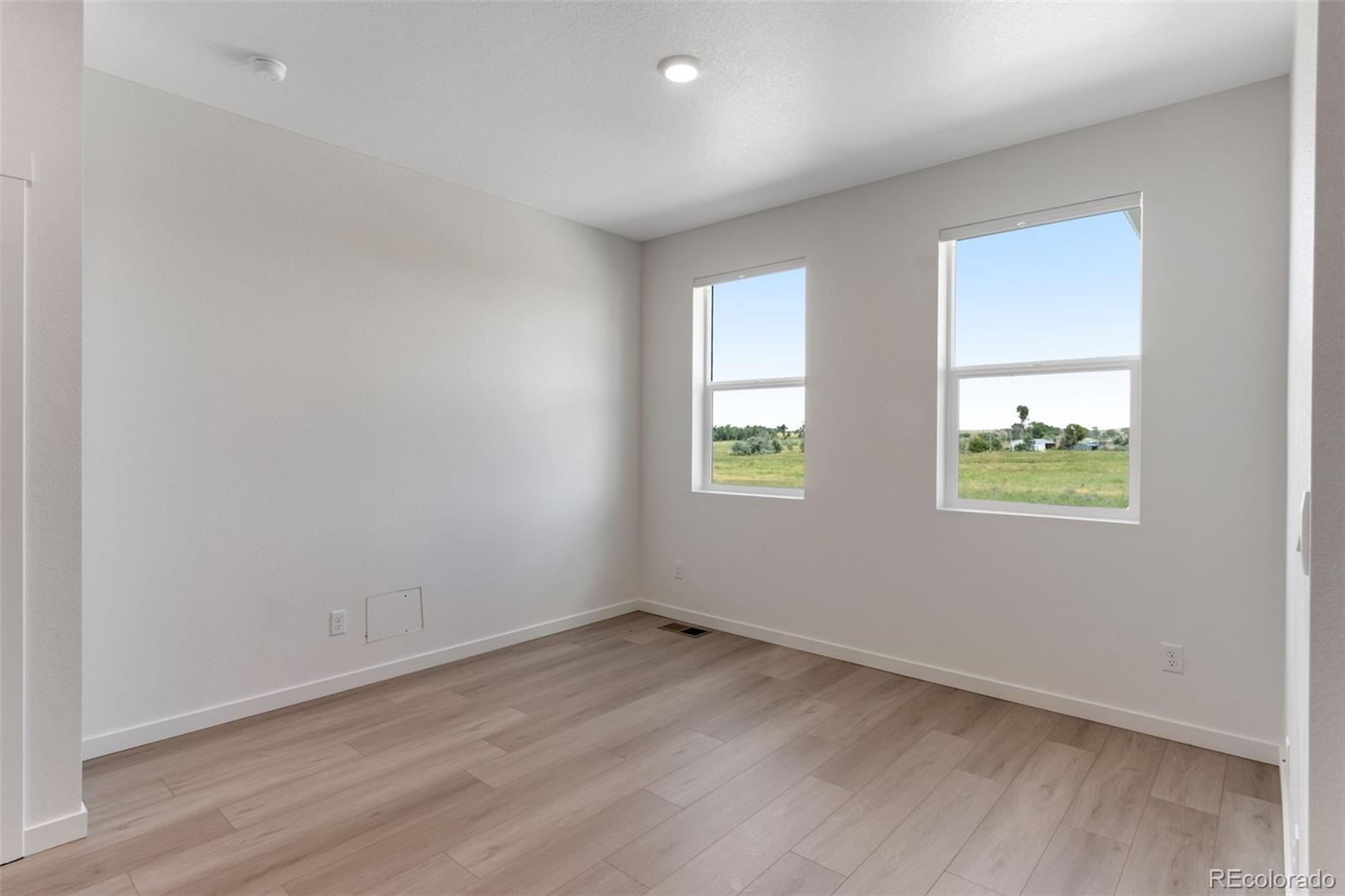 2344 Merlot Street Fort Lupton, CO 80621 - Photo 2 of 23 an empty room with windows