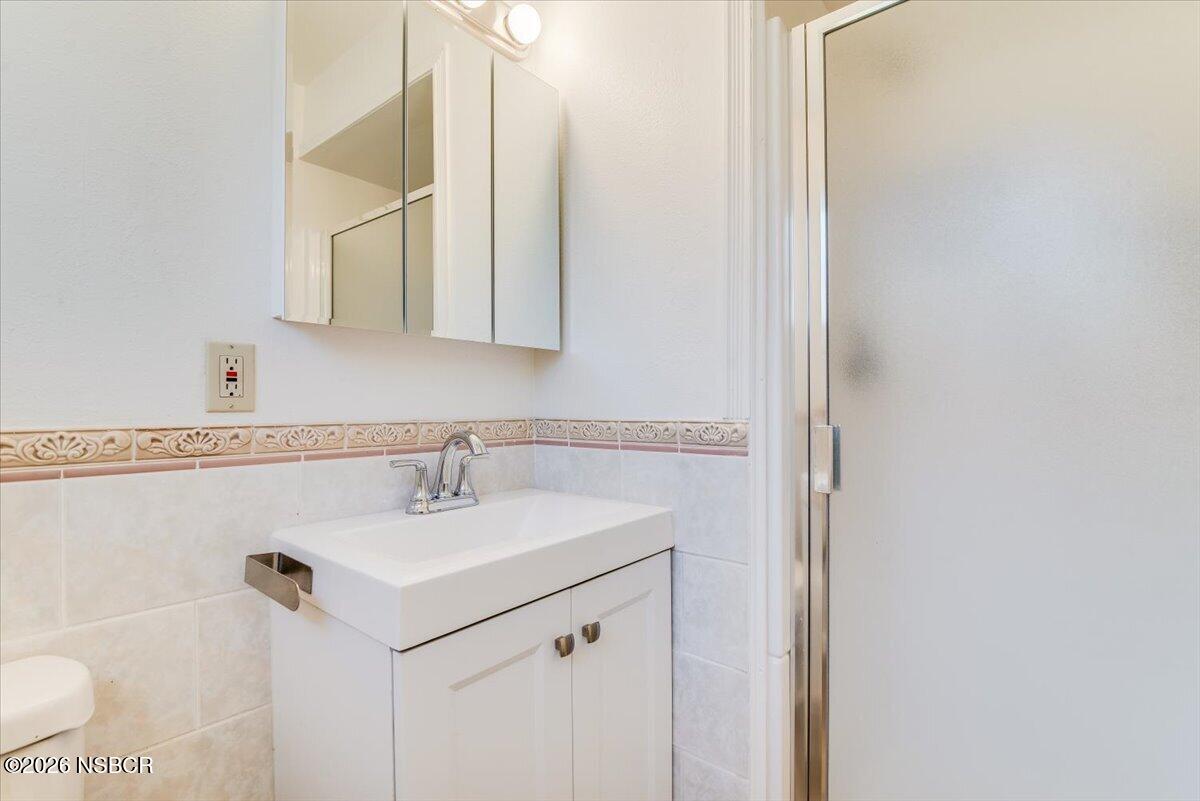 321 North Z Street Lompoc, CA 93436 - Photo 23 of 33 a bathroom with a sink and a mirror