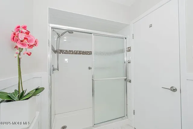 a view of an empty room with a glass door