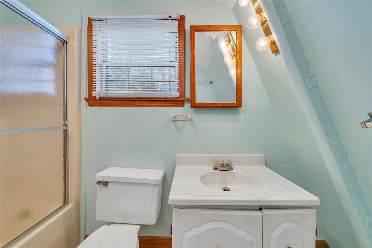 75 Johns Creek Road New Castle, VA 24127 - Photo 32 of 98 a bathroom with a sink a toilet and a mirror