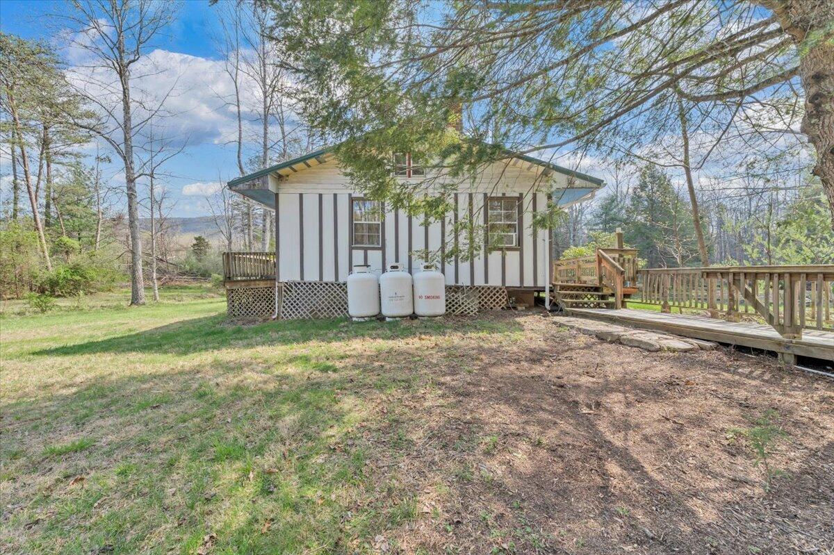 75 Johns Creek Road New Castle, VA 24127 - Photo 6 of 98 a view of a house with backyard and a tree