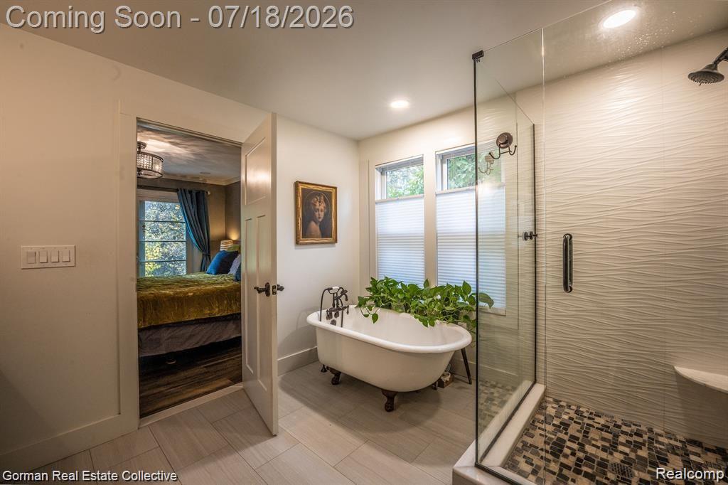 283 Phillips Avenue Clawson, MI 48017 - Photo 13 of 26 Ensuite bathroom, brand new windows, ceramic tile flooring, custom tiled shower, 1800's cast iron tub reglazed