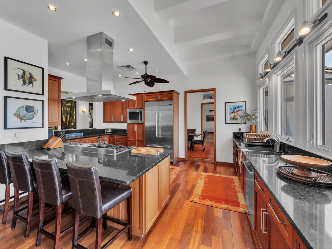 59-128 Olomana Road Kamuela, HI 96743 - Photo 11 of 30 a dining hall with stainless steel appliances granite countertop a stove and a sink