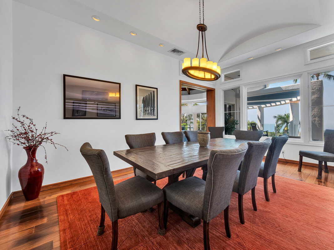 59-128 Olomana Road Kamuela, HI 96743 - Photo 12 of 30 a view of a dining room with furniture wooden floor and chandelier