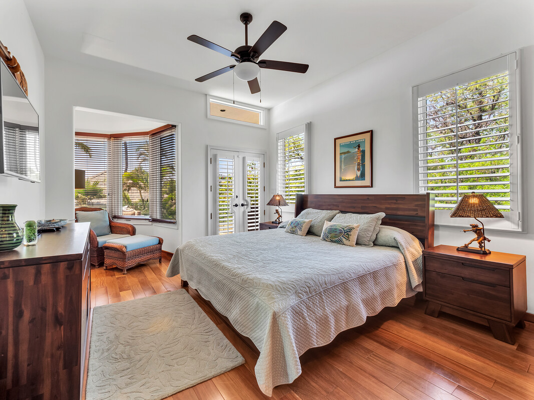 59-128 Olomana Road Kamuela, HI 96743 - Photo 20 of 30 a bedroom with a bed and wooden floor