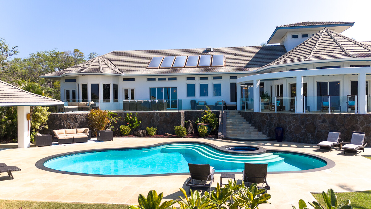 59-128 Olomana Road Kamuela, HI 96743 - Photo 24 of 30 a front view of a house with a yard table and chairs