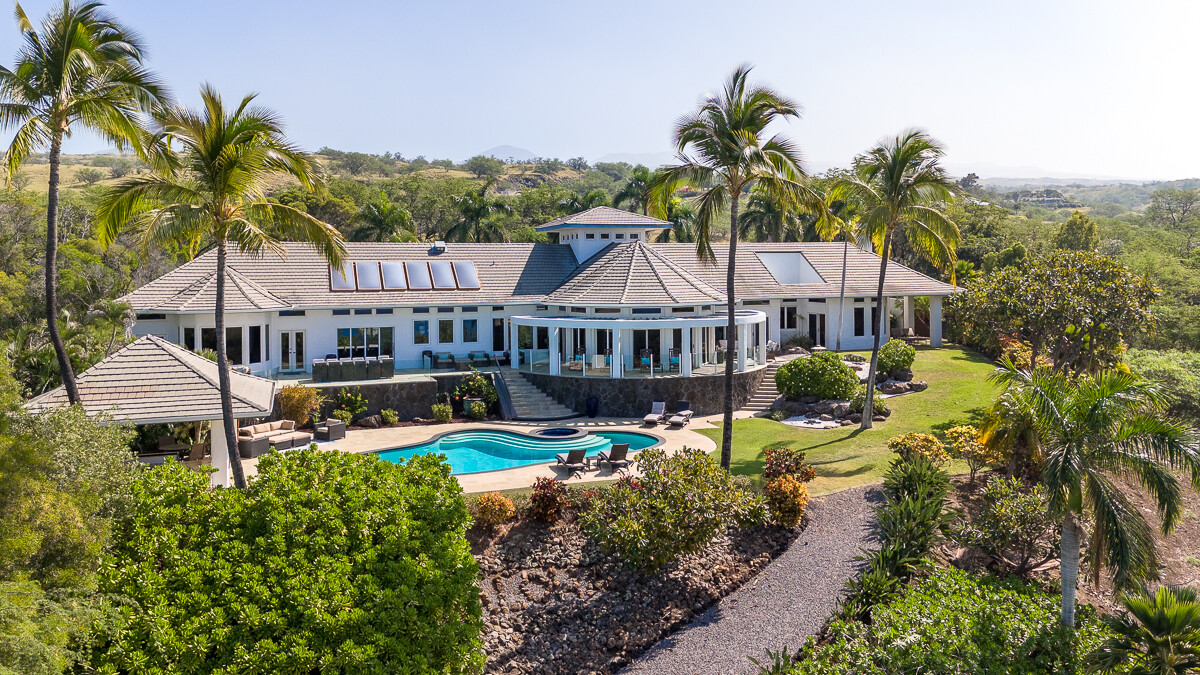 59-128 Olomana Road Kamuela, HI 96743 - Photo 4 of 30 a view of a house with a big yard and large trees