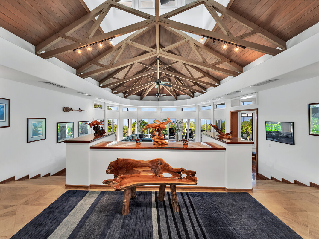 59-128 Olomana Road Kamuela, HI 96743 - Photo 6 of 30 a room with lots of wooden furniture and large windows