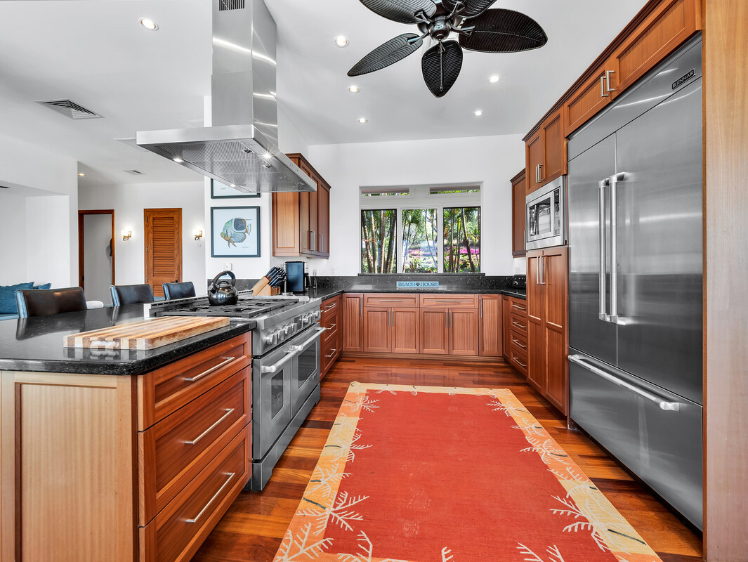 59-128 Olomana Road Kamuela, HI 96743 - Photo 10 of 30 a large kitchen with stainless steel appliances granite countertop a lot of counter space and a sink