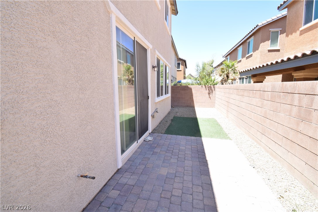 3622 Via Terracina Henderson, NV 89052 - Photo 22 of 22 A private outdoor space with a paver patio and ample room for relaxation.