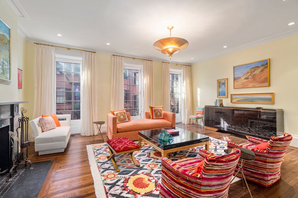17 West Cedar Street Boston, MA 02108 - Photo 1 of 42 a living room with furniture a fireplace and a large window