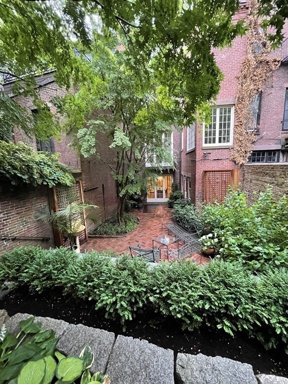 17 West Cedar Street Boston, MA 02108 - Photo 12 of 42 a view of a house with a yard and garden