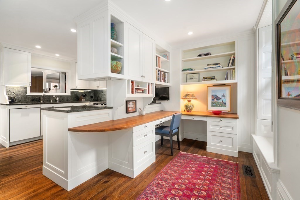 17 West Cedar Street Boston, MA 02108 - Photo 19 of 42 a large white kitchen with stainless steel appliances and cabinets