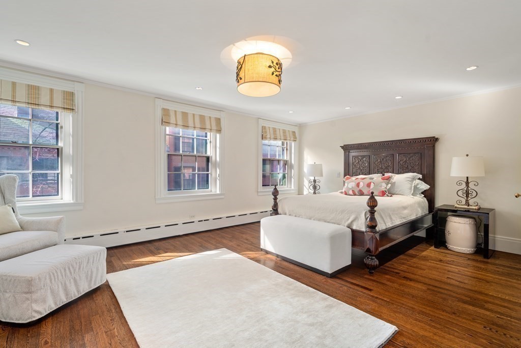 17 West Cedar Street Boston, MA 02108 - Photo 21 of 42 a spacious bedroom with a bed and a couch
