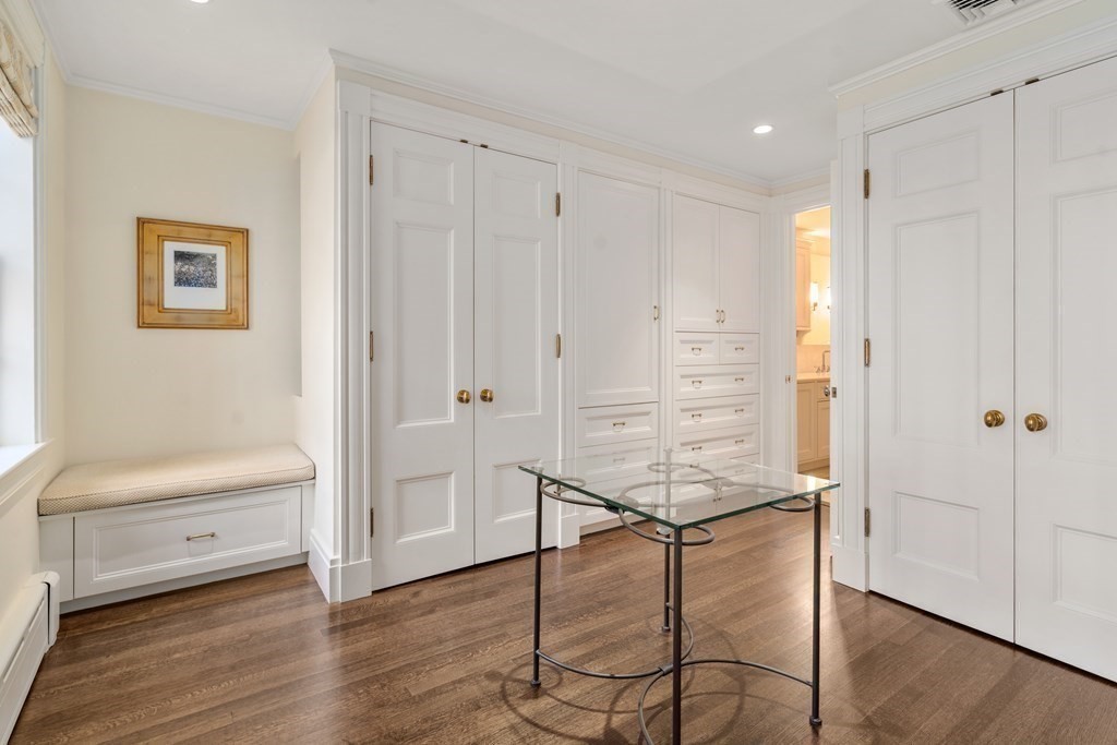 17 West Cedar Street Boston, MA 02108 - Photo 22 of 42 a view of a livingroom with wooden floor and a bathroom