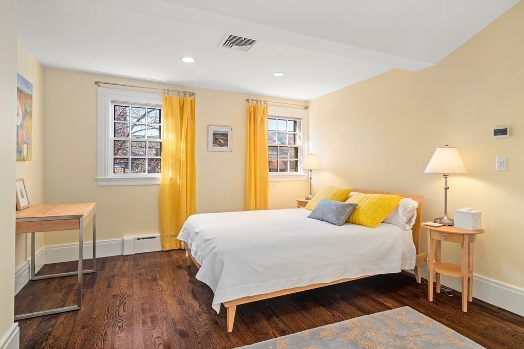 17 West Cedar Street Boston, MA 02108 - Photo 30 of 42 a bedroom with a bed and a chair