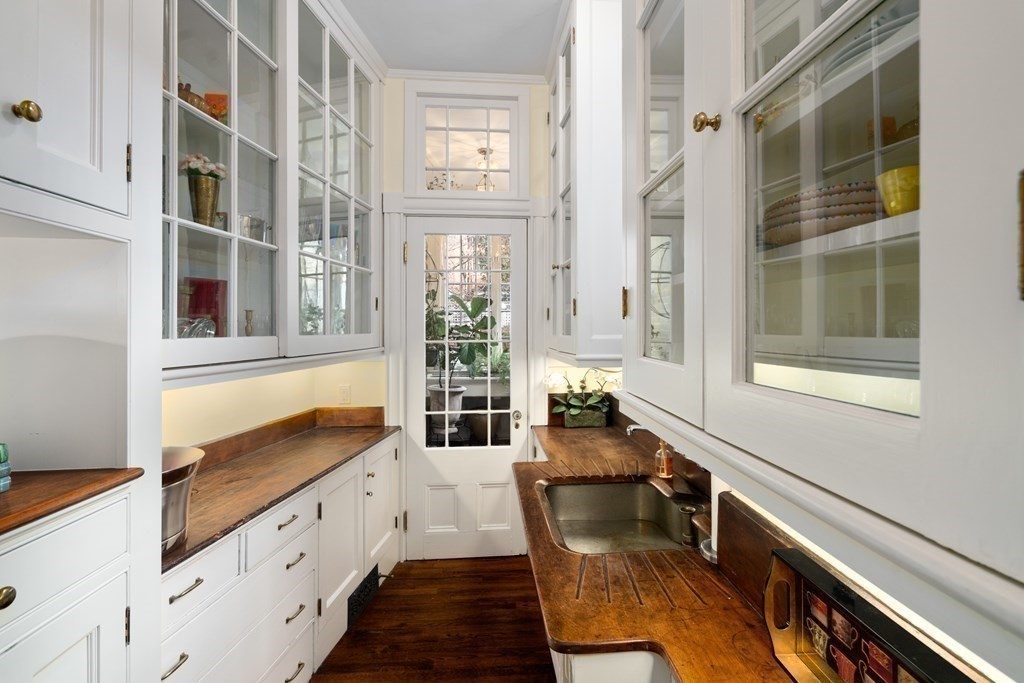 17 West Cedar Street Boston, MA 02108 - Photo 36 of 42 a kitchen with granite countertop a stove and a sink