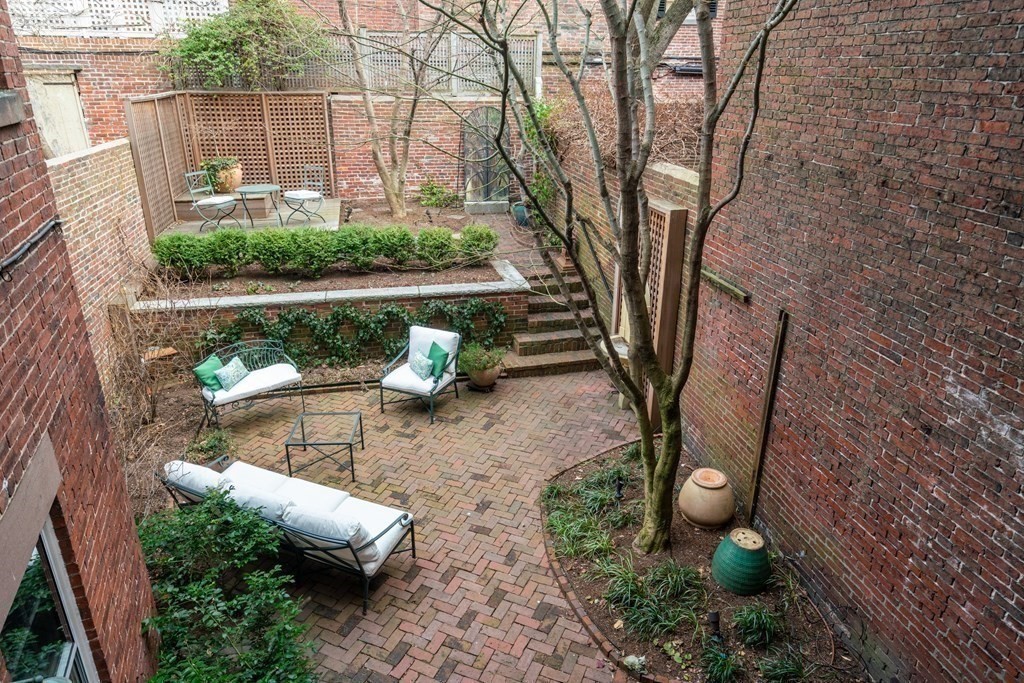 17 West Cedar Street Boston, MA 02108 - Photo 7 of 42 a view of a backyard with sitting area and furniture