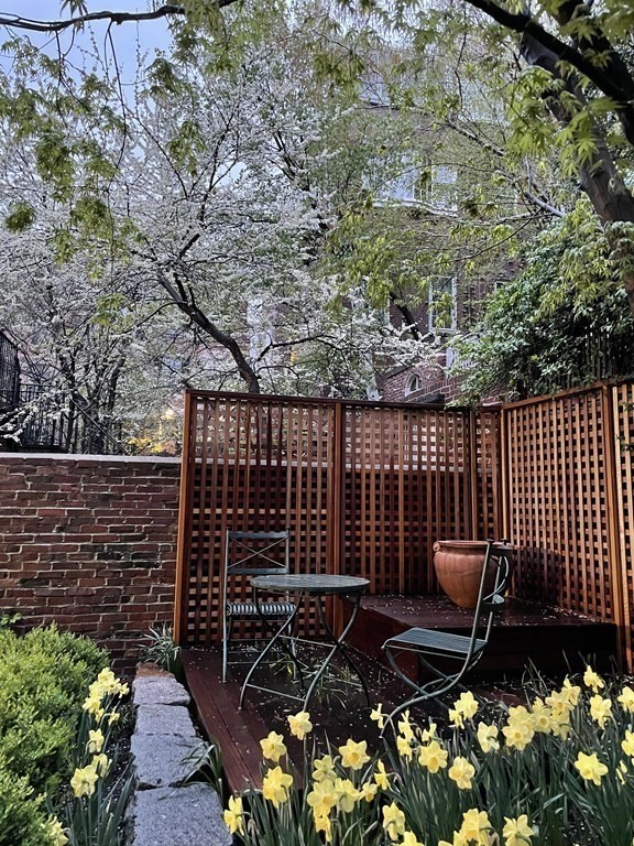17 West Cedar Street Boston, MA 02108 - Photo 10 of 42 a view of a chairs and bench in the backyard