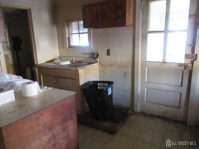 a kitchen with a refrigerator and a stove