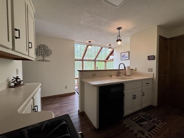 43 West Meadow Road, Unit 43 Haverhill, MA 01832 - Photo 18 of 42 a kitchen with sink cabinets and window