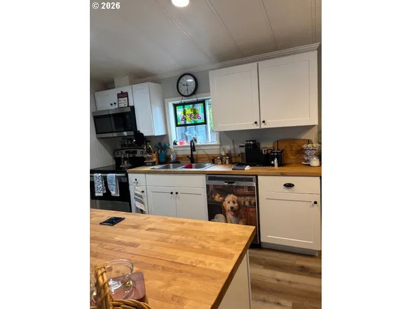 a kitchen with a refrigerator and window