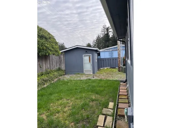 a backyard of a house with lots of green space
