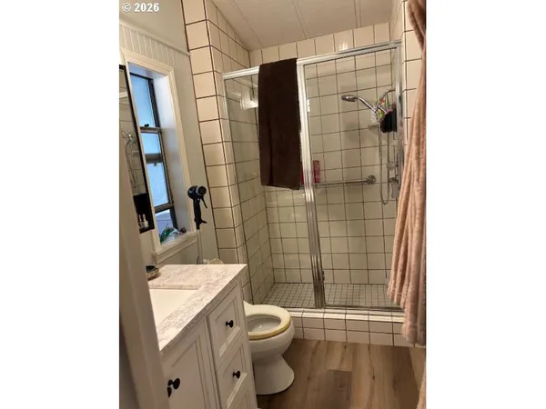 a bathroom with a toilet and shower