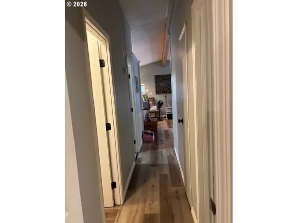 a view of a hallway with a white walls