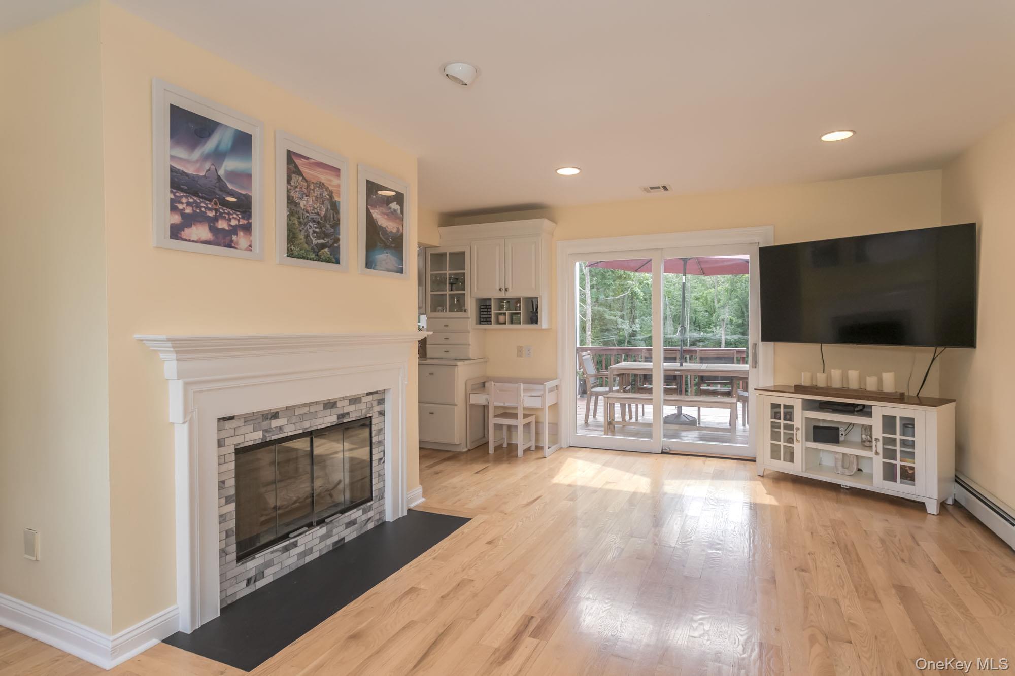 102 Beverly Road Chester, NY 10918 - Photo 18 of 49 a living room with furniture a flat screen tv and a fireplace